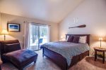 Master bedroom with a queen bed and a super comfy lounge chair. Private deck to enjoy your morning coffee as well. 